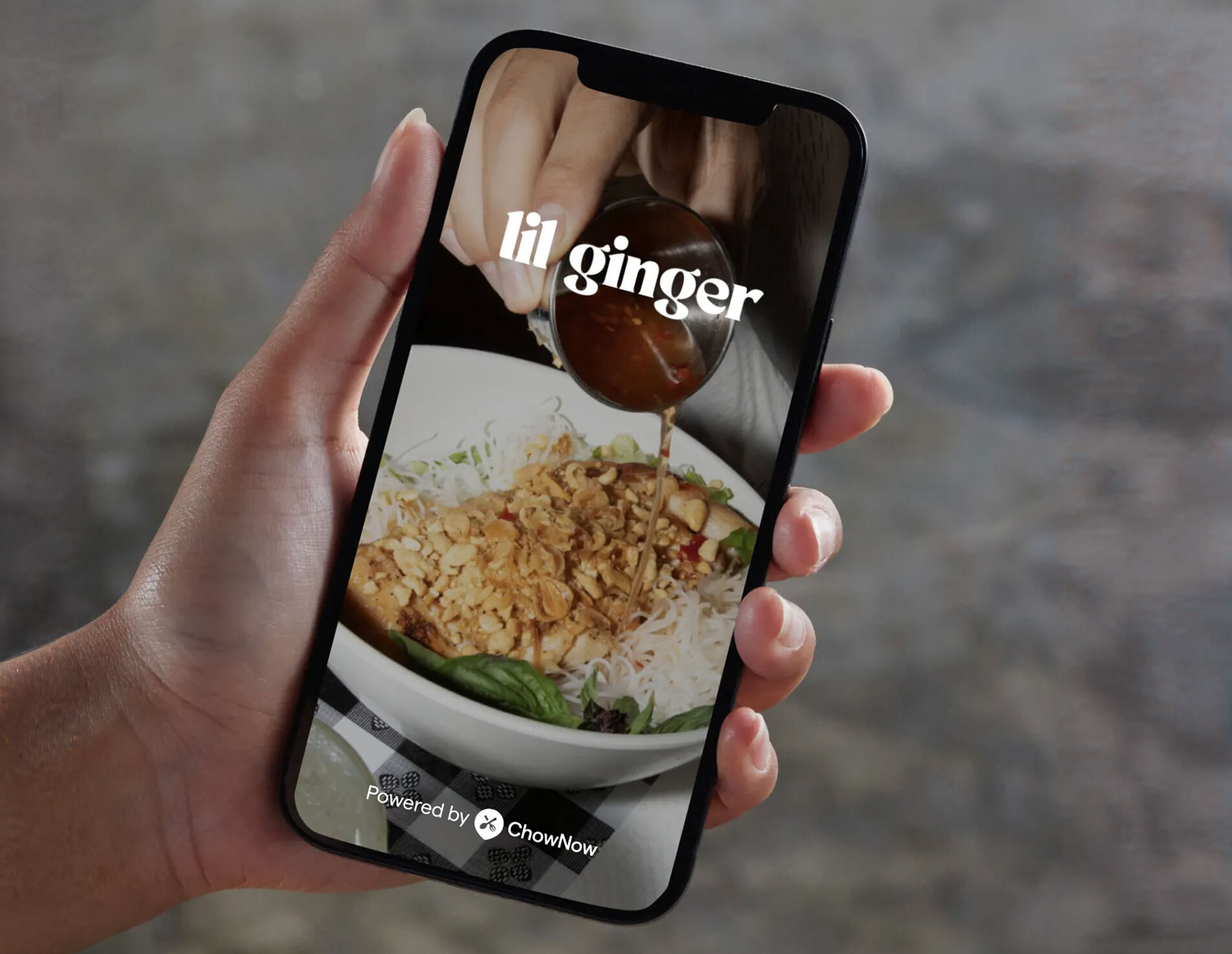 restaurant app on phone held by hand