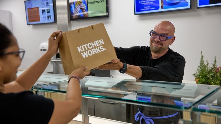 Chef Michael Symon serving holiday LTOs at Kitchen Works